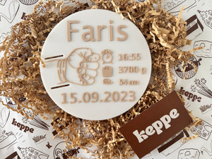 Personalized Baby Name Plate with Hospital wristband. White round plate with custom written birth date and weight of baby