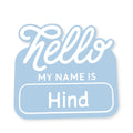 Name tag with 'Hello my name is Hind' text on a light blue background