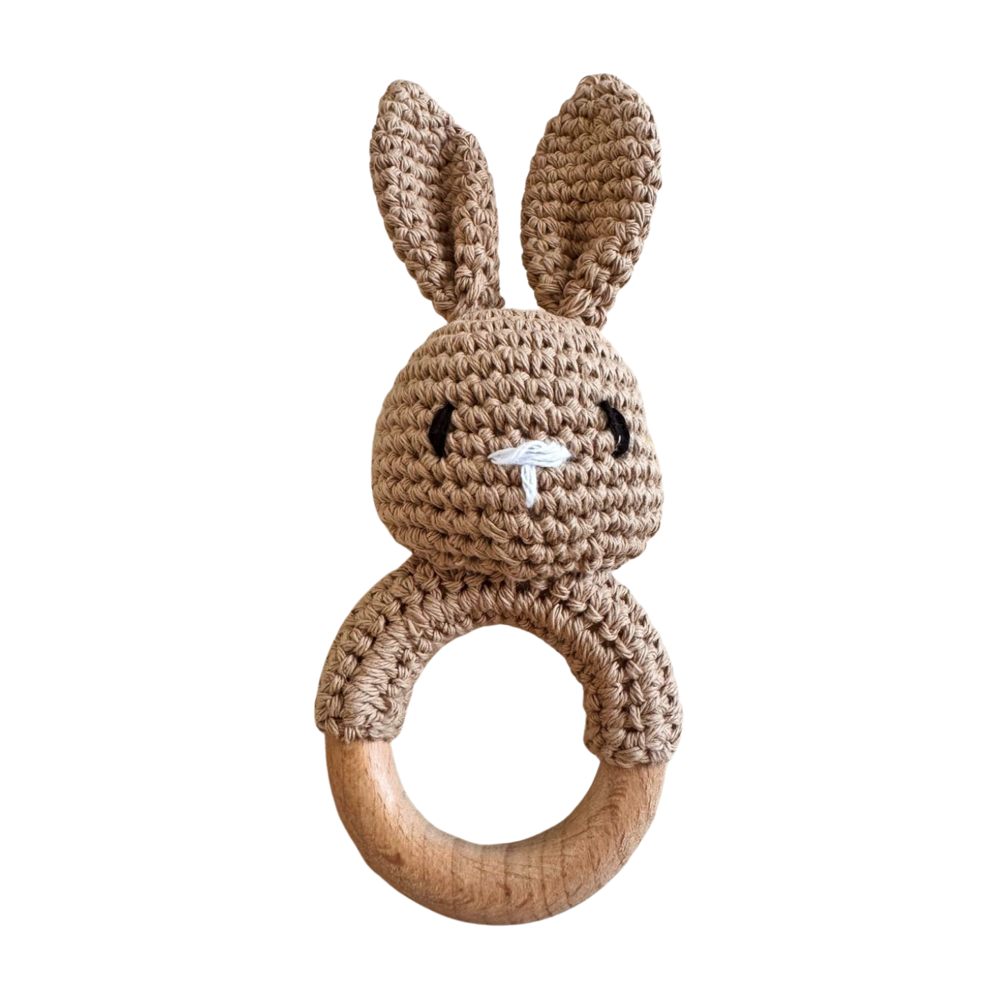 Crocheted rabbit rattle with wooden ring on a white background